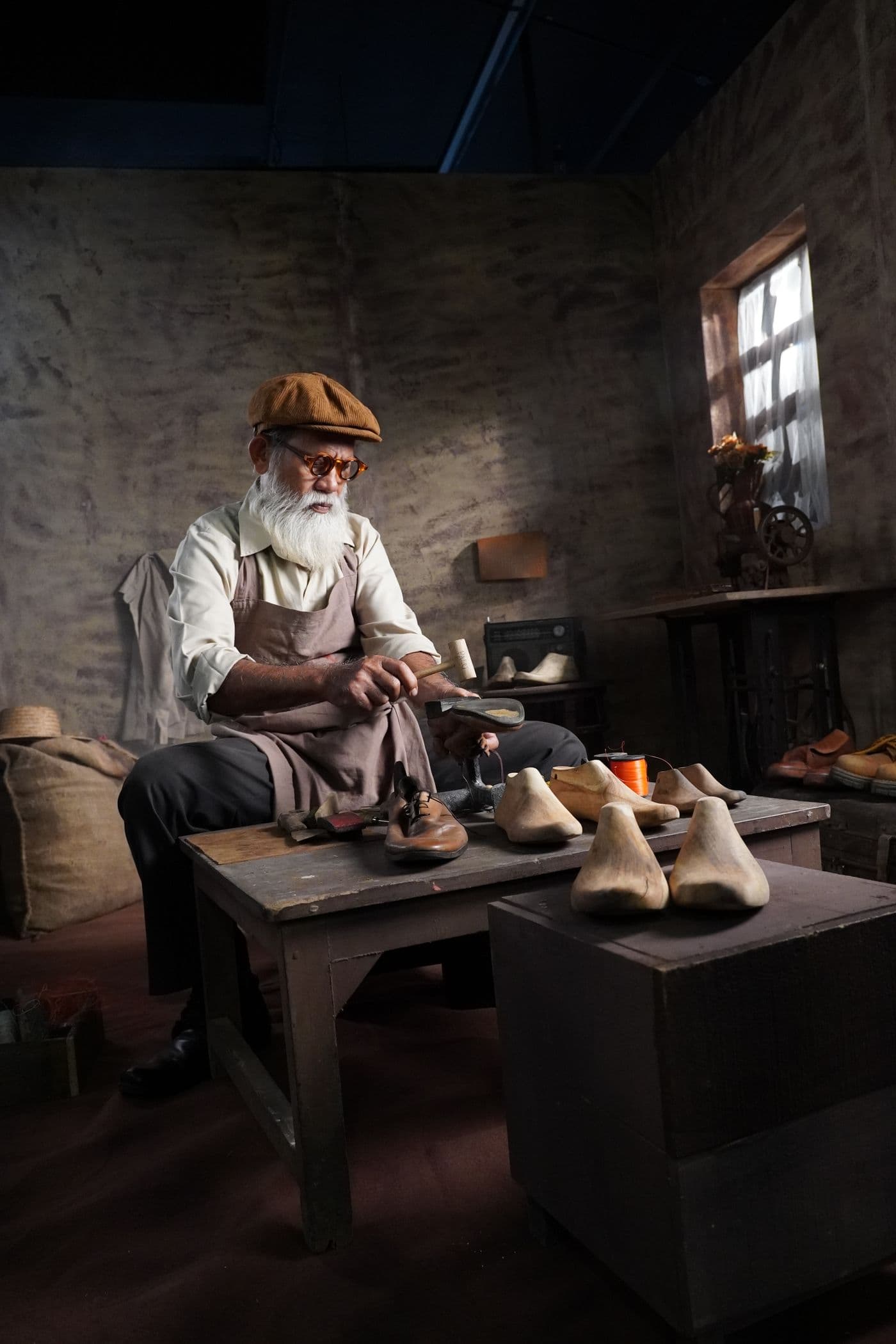 Master artisan crafting leather shoes by hand in a traditional workshop
